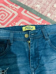 Distressed Blue Denim Jeans