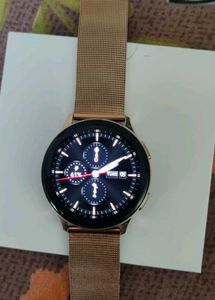 Gold Smartwatch And Two Dresses