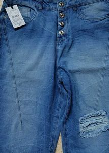 Ripped Blue Denim Jeans with tag