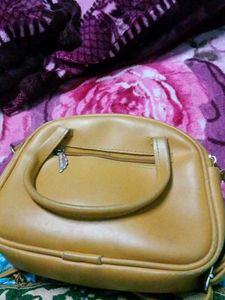 Tan Handbag with Butterfly Charm