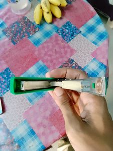 Stapler with pin remover