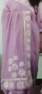 A very beautiful lavender colour saare with jdau work and shimmery padded blouse