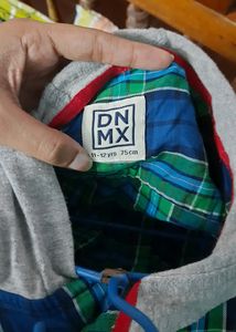 Stylish boys&#39; shirt with an attached hoodie.