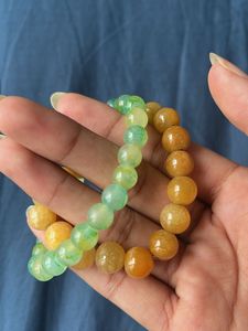 Beaded Bracelets In The Colours Green And Ochre