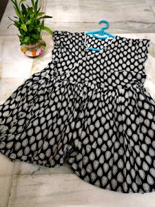 Flared Black Top With Teardrop Detail