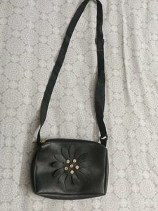 Stylish Black Sling Bag with Floral Cut Design