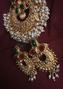 Rich Gold Jewellery Set Of One Detailed Worked Pendent With Two Royal Earings Completes Your Saree Look Perfectly