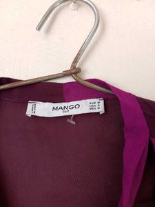 Branded two- tone wrap top.