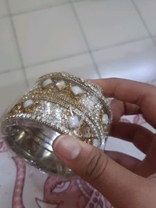 Stone Bangles Of White And Golden Color.