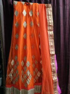Orange Net Unstitched Lehenga For Women