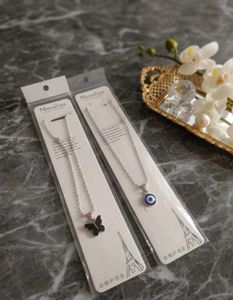 Layered Pearl &amp; Charm Necklace