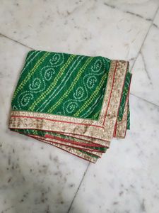 Green bandhni saree with golden border less