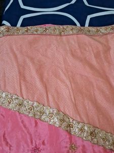 It Is Pink Color Georget With Golden Net Border .