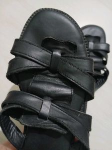 Black leather slides