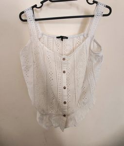 button-up tank top with spaghetti straps.