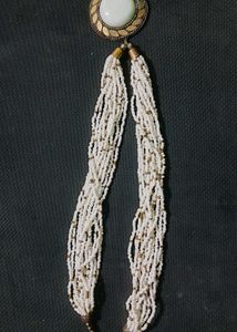 A Black Necklace along With White One