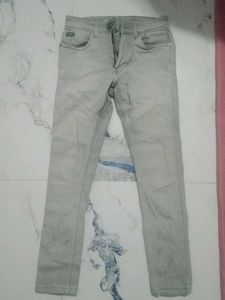 Gray Denim Jeans and a half shoulder shirt.