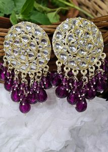 Golden Kundan With Purple Beads Earrings .