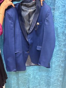It Is a Blazer With Waist Coat And Tie