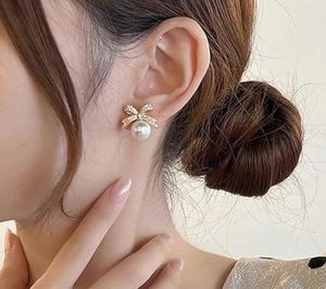 Sparkling Bow and Faux Pearl Gold Plated Studs