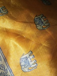 Ethnic Elephant pring yelloish orange saree...