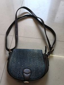 blue and dark brown sling bag
