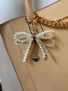 ₊˚⊹౨ pearl bow bagcharm/keychain ৎ ₊˚⊹