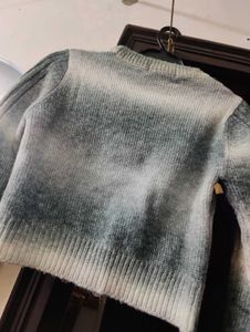 Stylish grey and white sweater