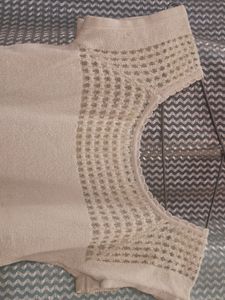 Strechable Top With Netted Design On Neck Bottom