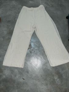 Beige Wide-Leg Sheer Overlay Trousers.