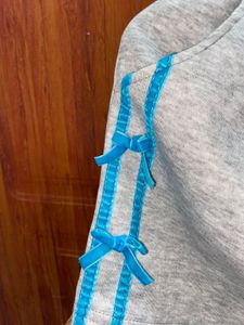 Girl&#39;s Gray Skirt with Blue Ribbon
