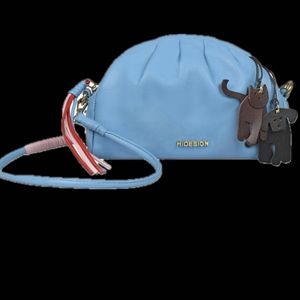 Hidesign sling with leather charm n dust bag