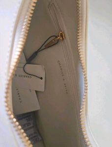 CHARLES &amp; KEITH Cream Philomena Half-Moon Bag