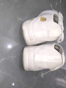white sneakers.