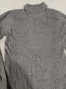 I am selling a turle neck grey colour winter top.