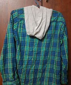 Stylish boys&#39; shirt with an attached hoodie.