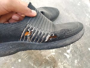 Worn Black Sneakers