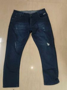 Distressed Blue Denim Jeans