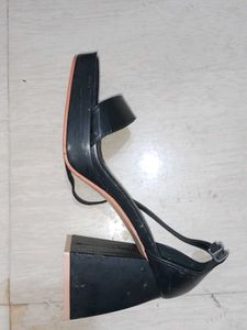 Strappy front open 3 inch black heels.
