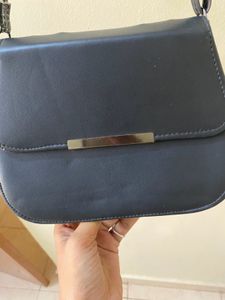 Black Colour Leather Sling And Also Shoulder Bag