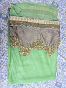 Lime Green Net Saree With Golden Trim