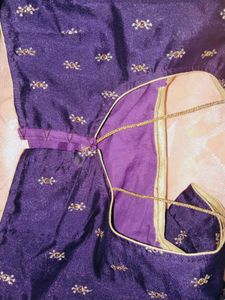 Crossandra saree with purple heavy blouse