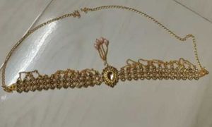 Gold tone headpiece