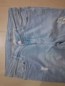 Distressed Light Wash Denim Jeans