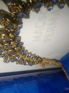 a golden colour necklace
