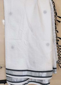 Kasuva Saree with black and silver bold border .