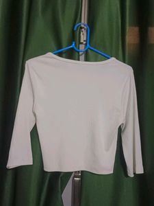 white top ripped straight jeans