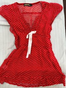 Red Polka Dot top with a white bow