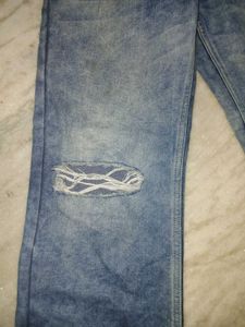 striped halter crop top and blue ripped jeans