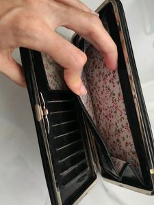 black wallet with press lock